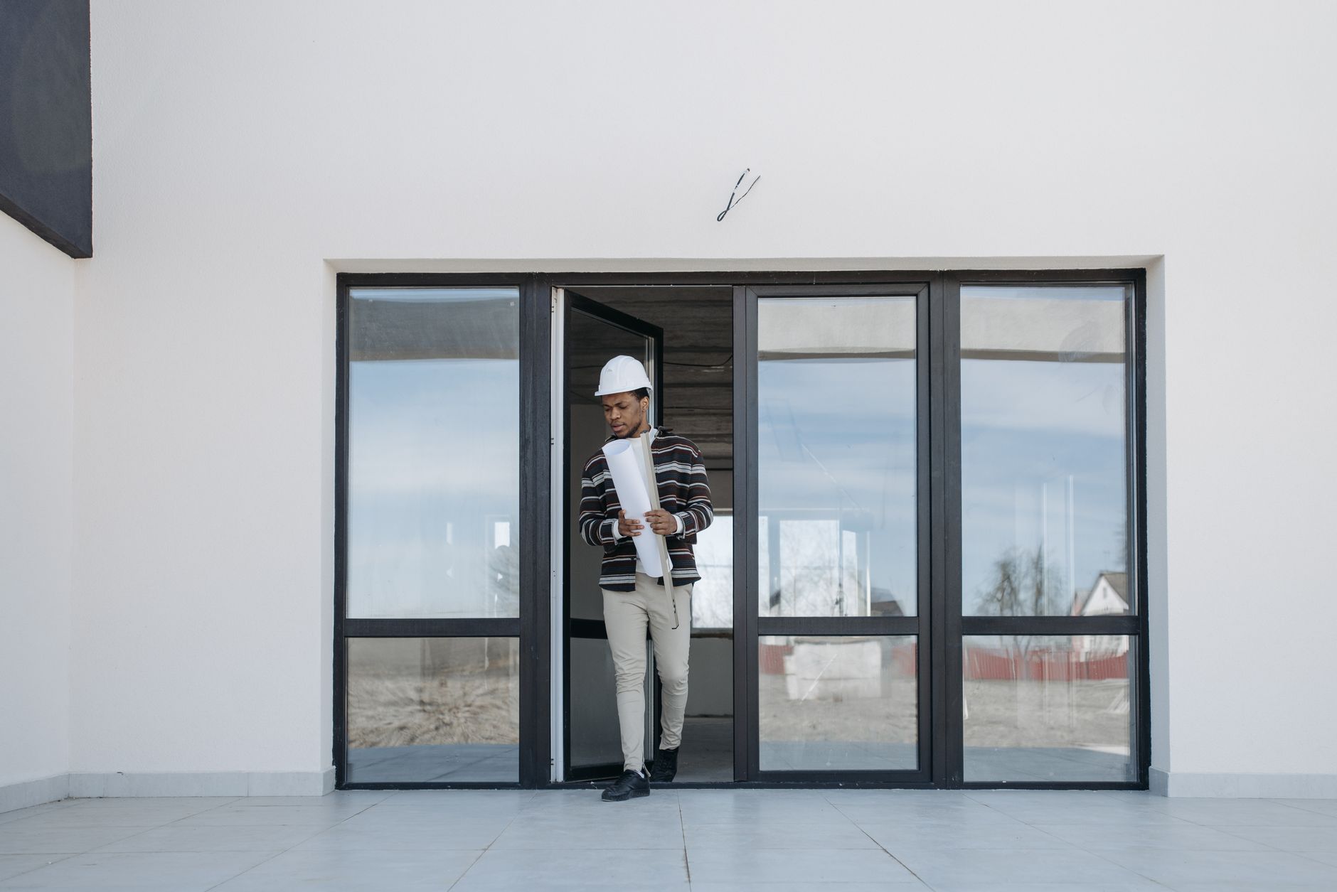 Construction workers framing a new home, showcasing step-by-step house building process
